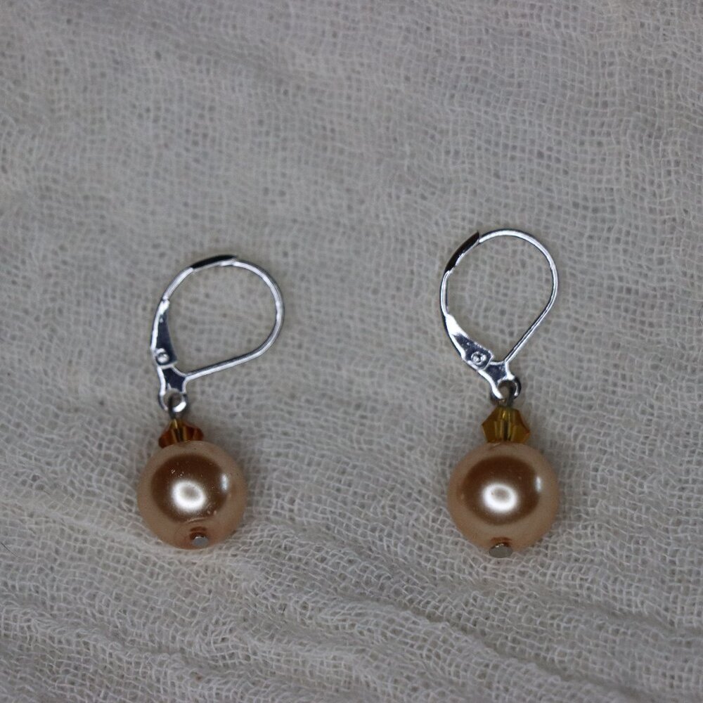 Round Peach Pearl styled drop earrings with silver color loops for pierced ears